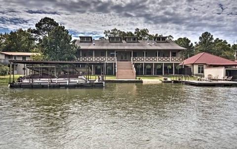 Back of house with b dock on left and swim dock  on right,top story is not used