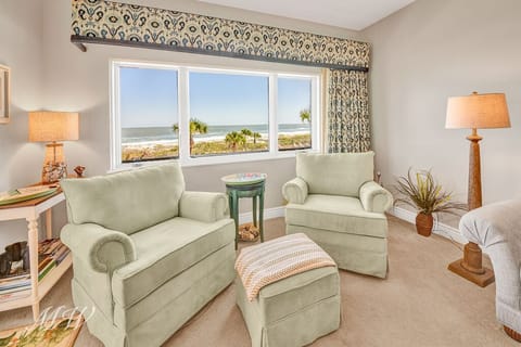 Comfortable rotating and rocking oceanview chairs in living room.