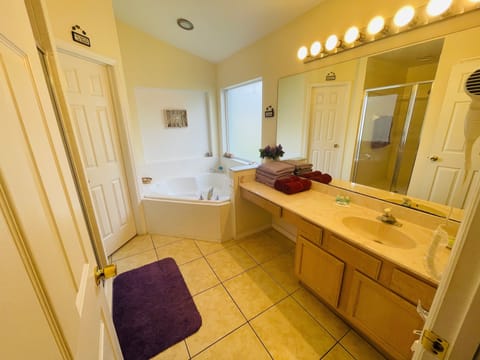 Combined shower/tub, hair dryer, towels, soap