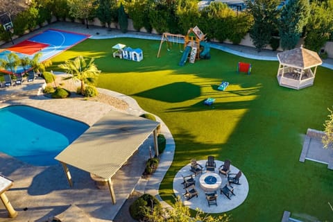 [Resort Property] Backyard amenities with heated pool, basketball court, playground, grill and firepit areas
