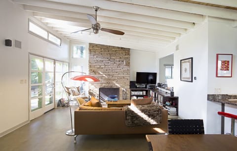 Vaulted living/dining/kit/studio with wood-burning FP