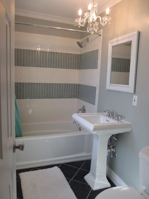 Combined shower/tub, hair dryer, towels, toilet paper