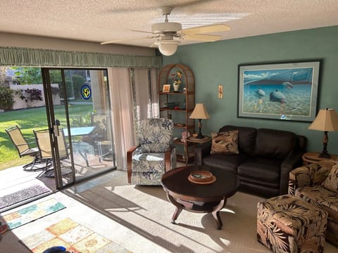 Comfortable chairs and leather couch. We are on ground floor with shady lanai.