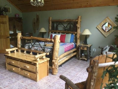 Enjoy sleeping in a hand crafted queen bed.