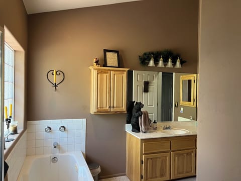 Master/upstairs bathroom has jetted tub and separate shower. 