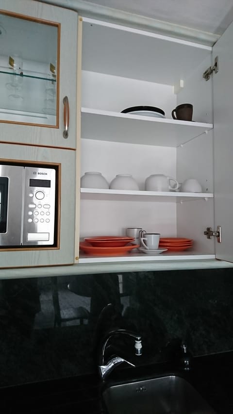 Microwave, dishwasher, coffee/tea maker, cookware/dishes/utensils