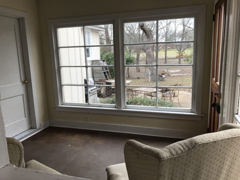 Sitting room looking out to back patio and pasture