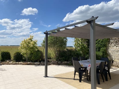 Patio with gazebo, outdoor table & 6 chairs