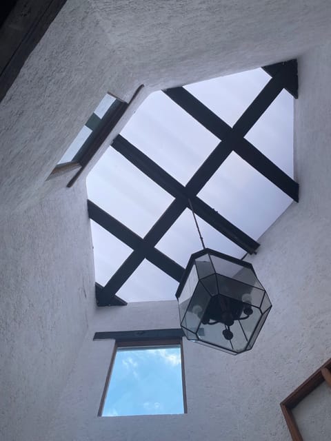 Skylight in kitchen with antique wood beams.