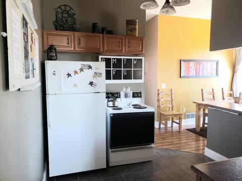 Fully furnished kitchen with full size fridge and brand new stove.