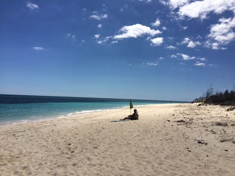 On the beach, sun loungers, beach towels