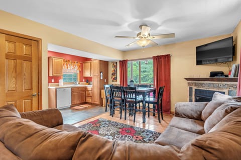 Living Room with Large Sectional Sofa and Dining Table that seats 8 people. 