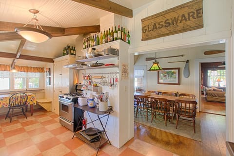 Kitchen on left looking into dining room and living room in distant right