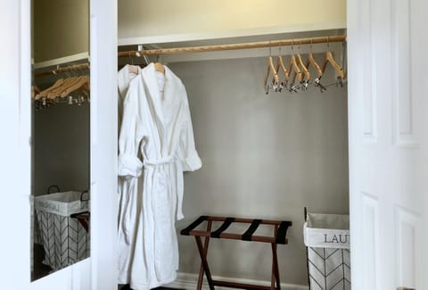 One of the guest closets. Wooden hangers and full length mirrors for dressing. White plushy bathrobes to spoil yourself