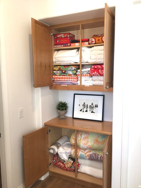 Upstairs linen closet with lots of extra , all cotton sheets and blankets