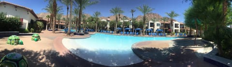 Main pool with beach entry, childrens fountain area, restrooms, cabanas