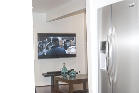 Watch the TV from the kitchen - don't miss any of the action