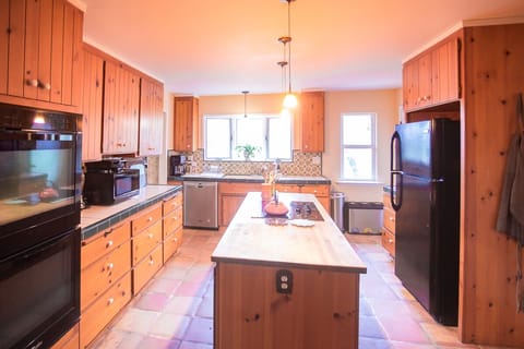 Main floor Chef's Kitchen with Double Oven; one of two full kitchens