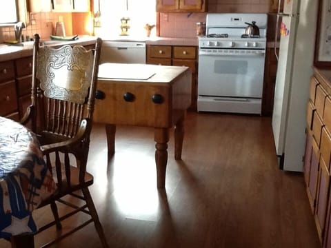 Large and spacious custom kitchen with antique oak chopping block.