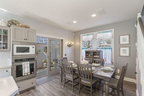 Kitchen and Dining Area with Back Patio Access