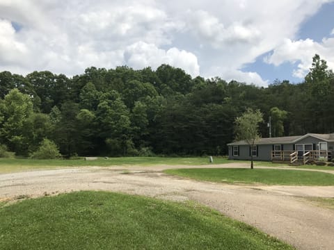 Pond sits right out from house with a large front yard and lots of parking 