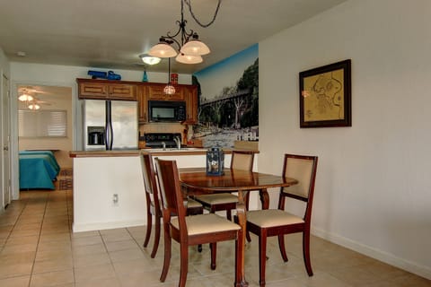 View of dining area, kitchen and the bedroom