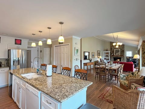Island seats 4 + 10 seats at the Dining Area table. The open floor plan is ideal for family or large group gatherings