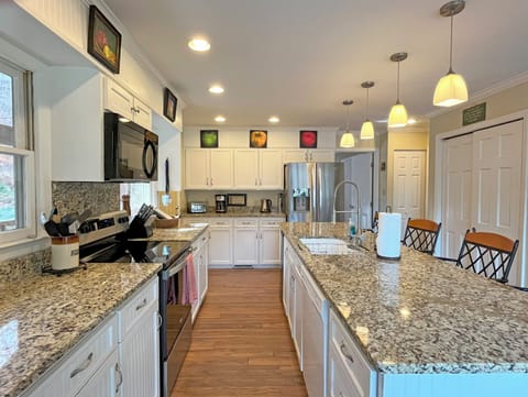 Kitchen has a large Island work area, and is well stocked for home cooking