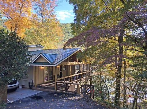 Easy access to Main Level of the house from driveway and covered carport. Kitchen, Dining, Familly Room, Master Bedroom and another Queen Bedroom are all on the Main level. Driveway plus gravel parking area easily accommodates 4 vehicles.