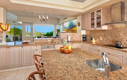 Fabulous open kitchen with ocean view! - The kitchen faces the dining area and overlooks the golf course and ocean beyond.