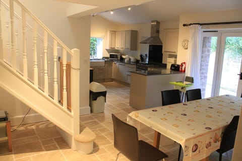 Field Barn - dining area and kitchen behind