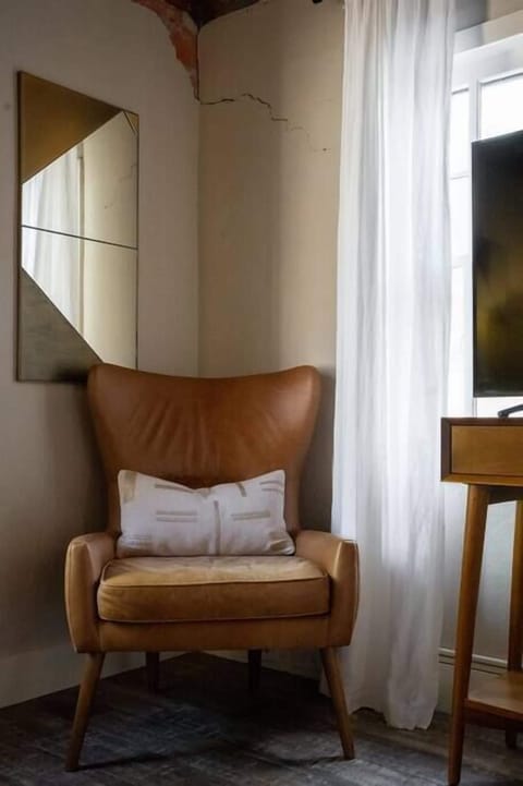 Reading Nook – Cozy chair for quiet moments.