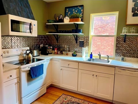 Large sunny kitchen equipped with all you need during your stay