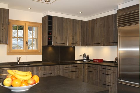 Spacious kitchen with large American style fridge