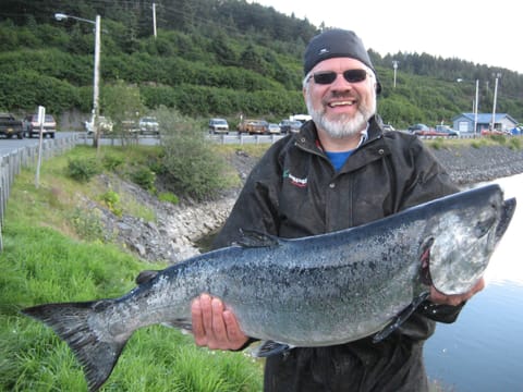 One of the co-owners with a King Salmon.