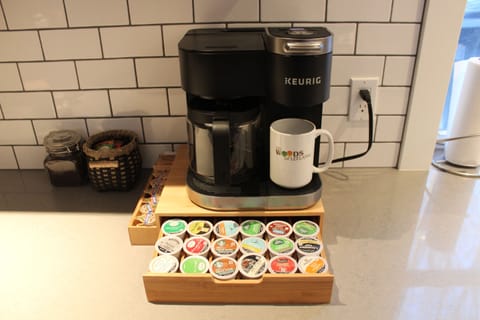 Keurig coffee maker with k cups and pot.  Assortment of coffee and teas.