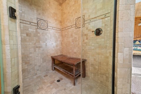 Beautiful Steam Shower. - Beautiful Steam Shower with rock wall and two showerheads. Master Bath Spacious Rain Drop shower with steam shower.