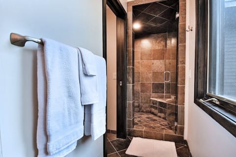 Large slate shower with bench and European glass door