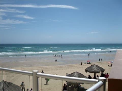 On the beach, sun loungers, beach towels