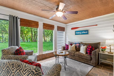 Sunroom off the Main Living Area has a full-sizeeper Sofa and view of Lake