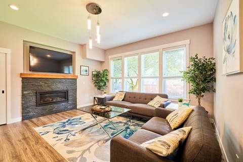 65” smart TV, Wi-Fi and a contemporary gas fireplace are the focal points