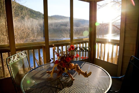 Screened in porch overlooking Lake Taneycomo
