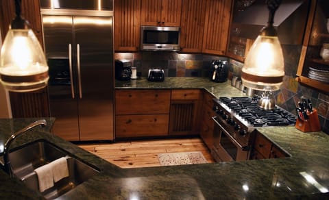 Gourmet kitchen from the living room angle.