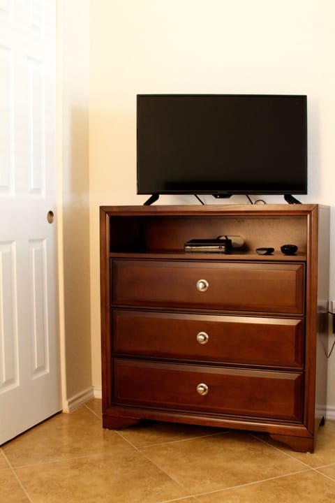Chest & flat screen tv in the guest bedroom in our vacation rental. Sun City TX