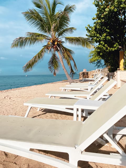 On the beach, sun loungers, beach towels