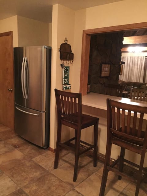 Stainless refrigerator with ice maker.