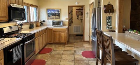 Fully stocked kitchen including dishwasher, gas stove and microwave.