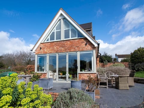 Outside of the property with south facing patio