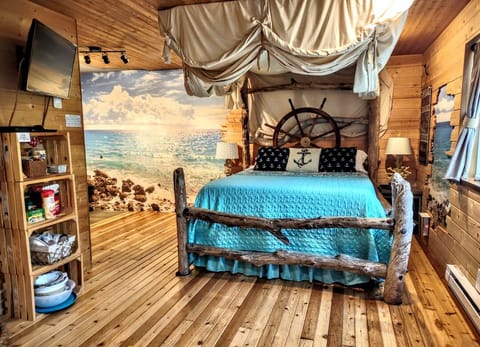Fun authentic driftwood bed, luxurious mattress & cool drop-down privacy canopy!