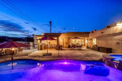 Breathtaking backyard view w/wonderful pool/spa and outdoor kitchen/firepit